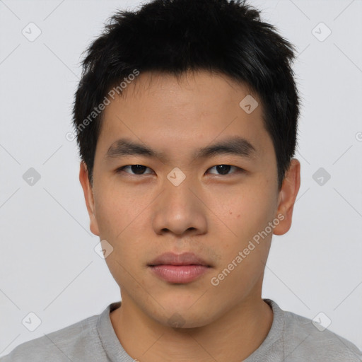 Neutral asian young-adult male with short  brown hair and brown eyes