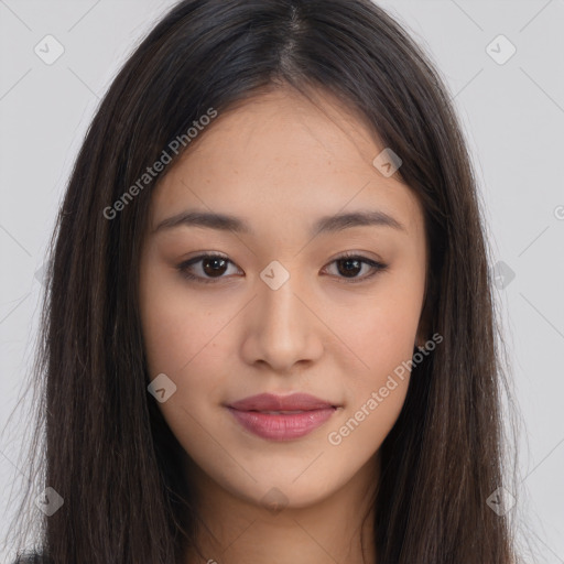 Joyful asian young-adult female with long  brown hair and brown eyes