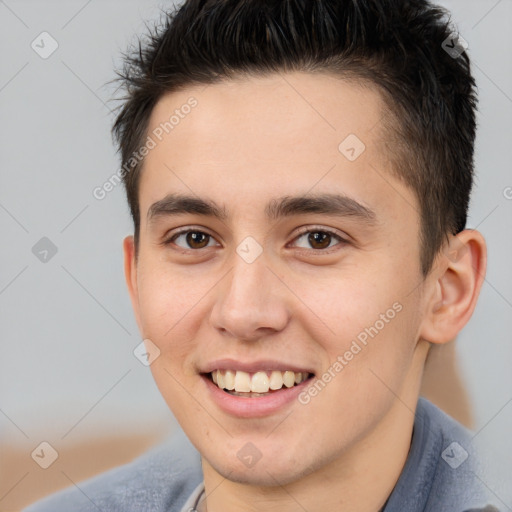 Joyful white young-adult male with short  brown hair and brown eyes