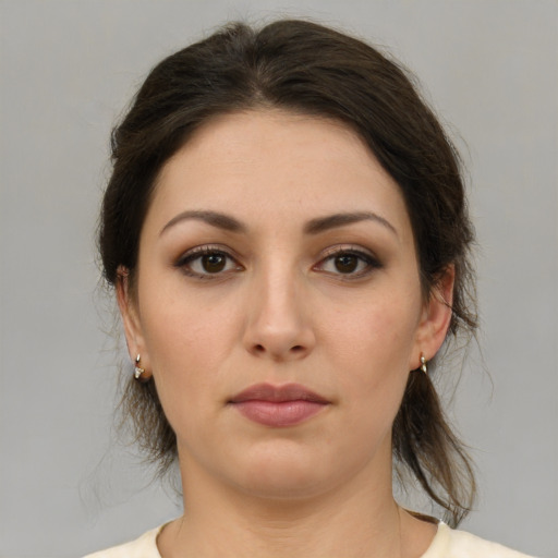 Neutral white young-adult female with medium  brown hair and brown eyes