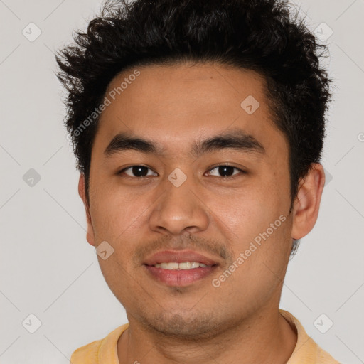 Joyful latino young-adult male with short  brown hair and brown eyes