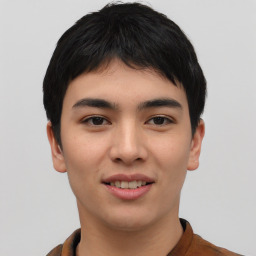 Joyful asian young-adult male with short  black hair and brown eyes