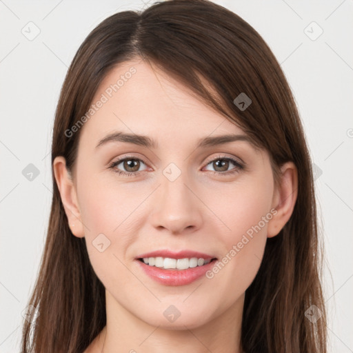 Joyful white young-adult female with long  brown hair and grey eyes