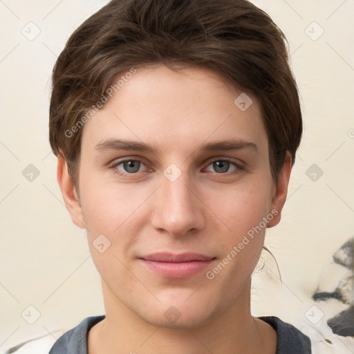 Joyful white young-adult female with short  brown hair and grey eyes