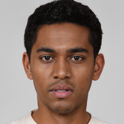 Neutral black young-adult male with short  black hair and brown eyes