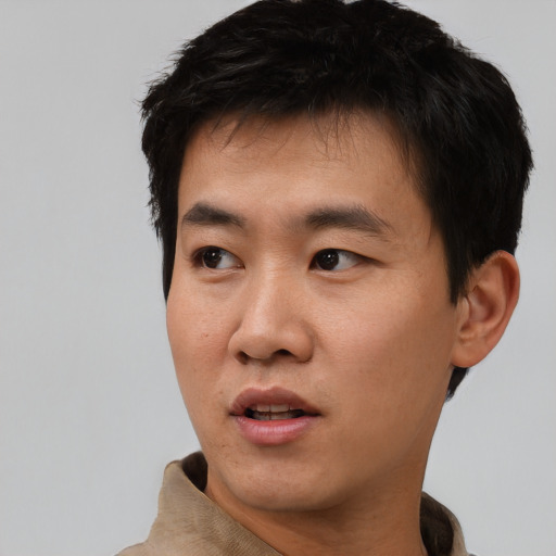 Neutral asian young-adult male with short  black hair and brown eyes