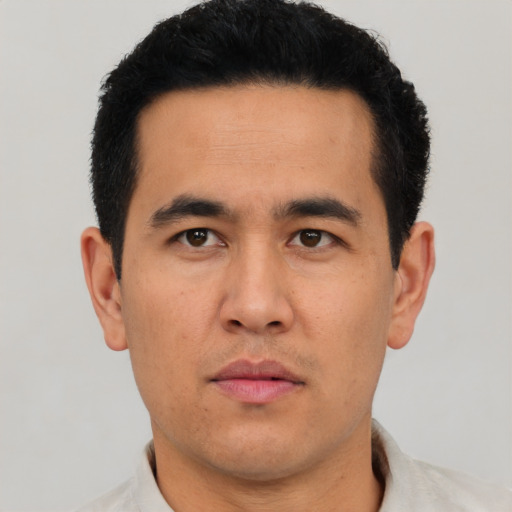 Neutral latino young-adult male with short  black hair and brown eyes