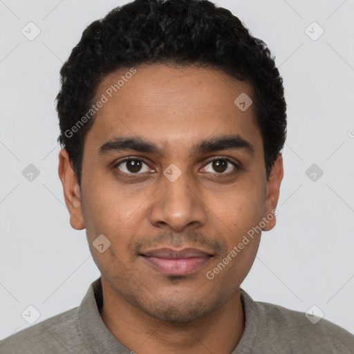 Joyful latino young-adult male with short  black hair and brown eyes