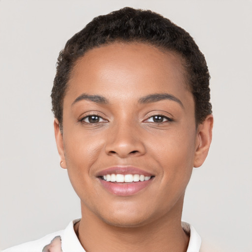 Joyful latino young-adult female with short  brown hair and brown eyes