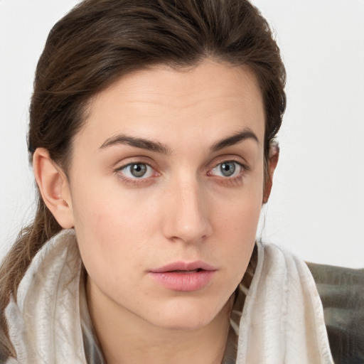 Neutral white young-adult female with long  brown hair and grey eyes