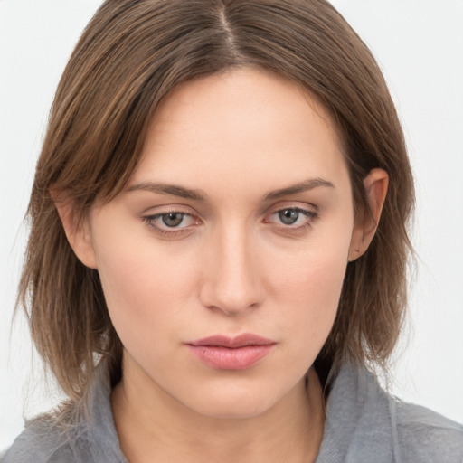 Neutral white young-adult female with medium  brown hair and grey eyes