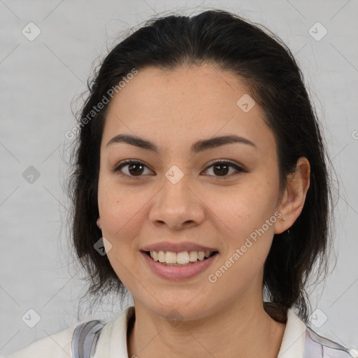 Joyful latino young-adult female with medium  brown hair and brown eyes