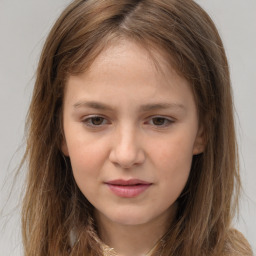 Joyful white child female with long  brown hair and brown eyes