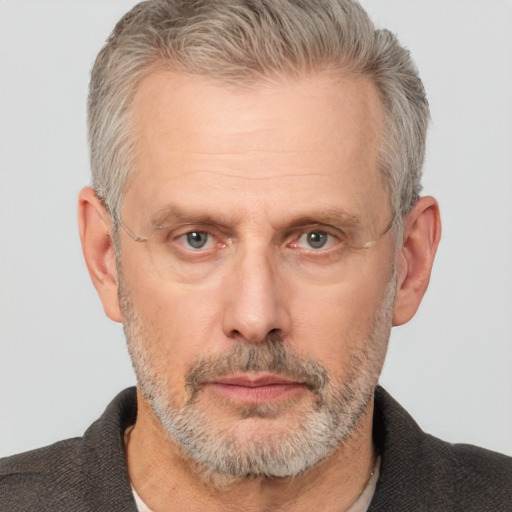 Neutral white middle-aged male with short  gray hair and brown eyes