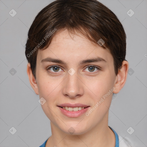 Joyful white young-adult female with short  brown hair and grey eyes