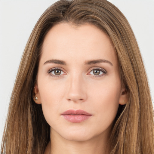 Neutral white young-adult female with long  brown hair and brown eyes