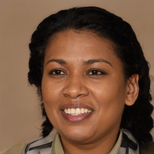 Joyful latino adult female with short  black hair and brown eyes