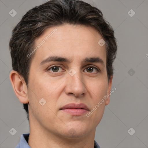 Joyful white adult male with short  brown hair and grey eyes