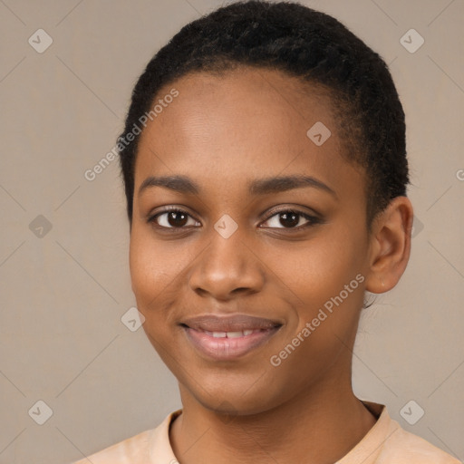 Joyful black young-adult female with short  brown hair and brown eyes