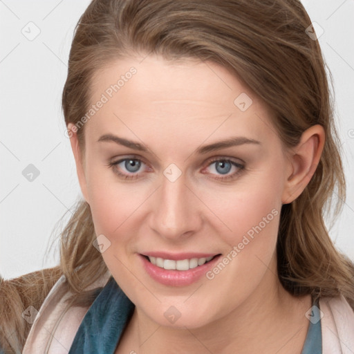 Joyful white young-adult female with long  brown hair and blue eyes