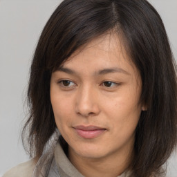 Neutral asian young-adult female with medium  brown hair and brown eyes