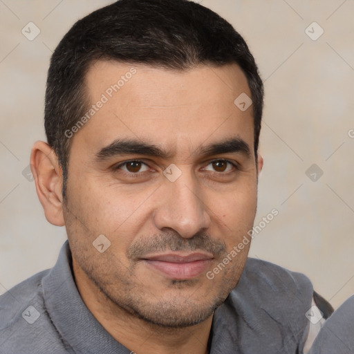 Joyful white young-adult male with short  black hair and brown eyes