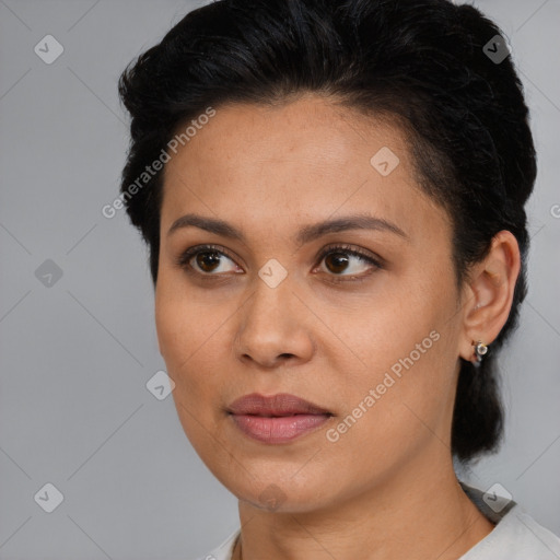 Joyful latino young-adult female with short  brown hair and brown eyes