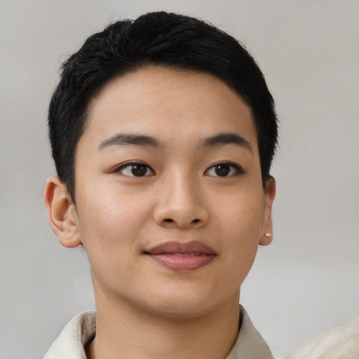 Joyful asian young-adult female with short  black hair and brown eyes
