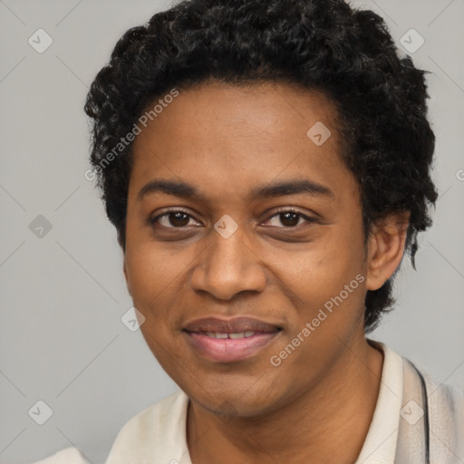 Joyful black young-adult female with short  black hair and brown eyes