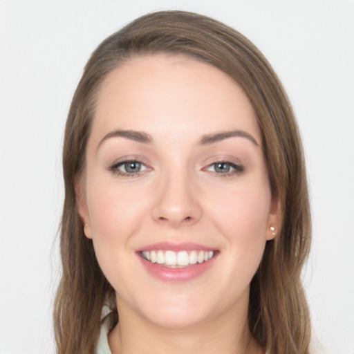 Joyful white young-adult female with long  brown hair and grey eyes