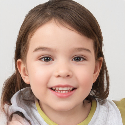 Joyful white child female with medium  brown hair and brown eyes