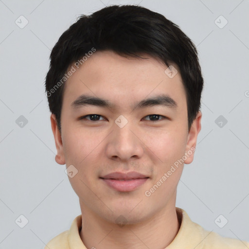 Joyful asian young-adult male with short  black hair and brown eyes