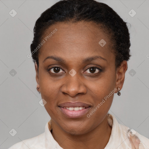 Joyful black young-adult female with short  brown hair and brown eyes