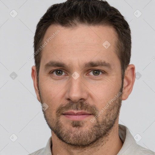 Joyful white adult male with short  brown hair and grey eyes