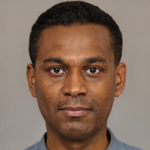 Neutral black young-adult male with short  black hair and brown eyes