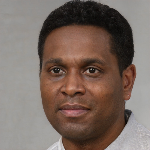 Neutral black young-adult male with short  black hair and brown eyes