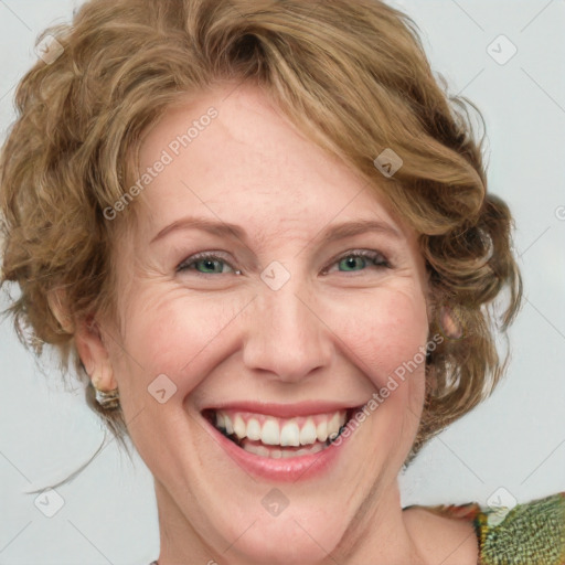 Joyful white adult female with medium  brown hair and green eyes