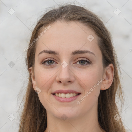 Joyful white young-adult female with long  brown hair and grey eyes