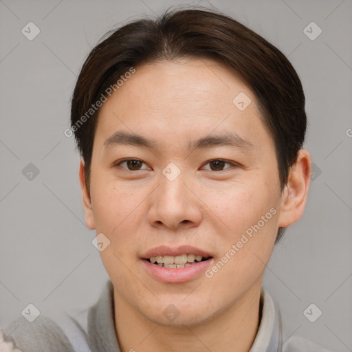 Joyful asian young-adult male with short  brown hair and brown eyes