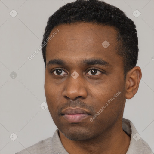 Neutral black young-adult male with short  black hair and brown eyes