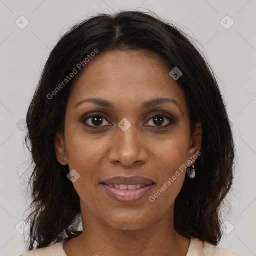 Joyful black young-adult female with medium  brown hair and brown eyes