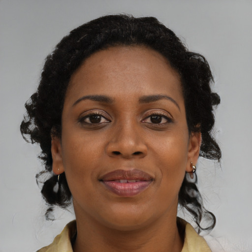Joyful black young-adult female with medium  black hair and brown eyes
