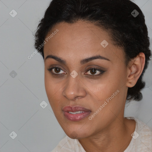 Joyful black young-adult female with short  black hair and brown eyes