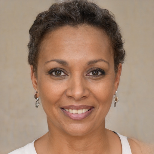 Joyful white adult female with short  brown hair and brown eyes