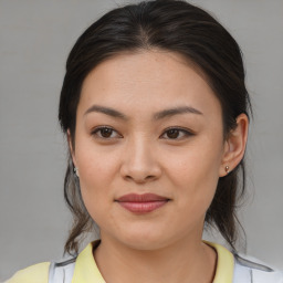 Joyful asian young-adult female with medium  brown hair and brown eyes