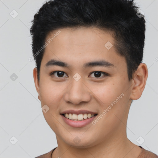 Joyful asian young-adult male with short  brown hair and brown eyes