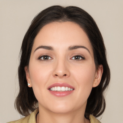 Joyful white young-adult female with medium  brown hair and brown eyes