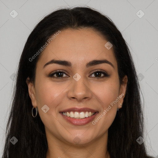 Joyful latino young-adult female with long  brown hair and brown eyes