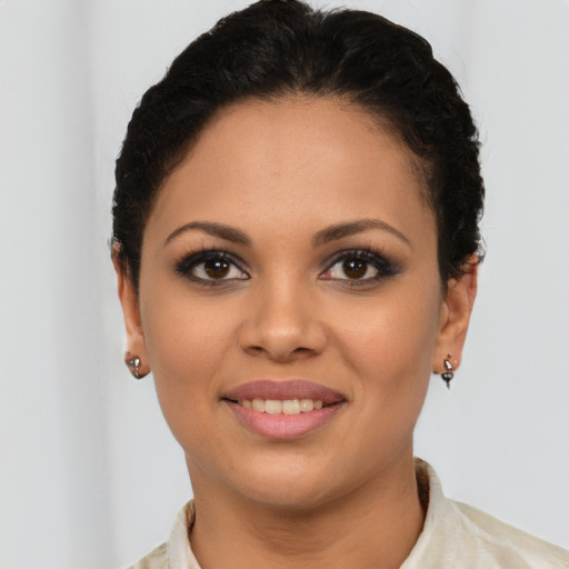 Joyful latino young-adult female with short  brown hair and brown eyes