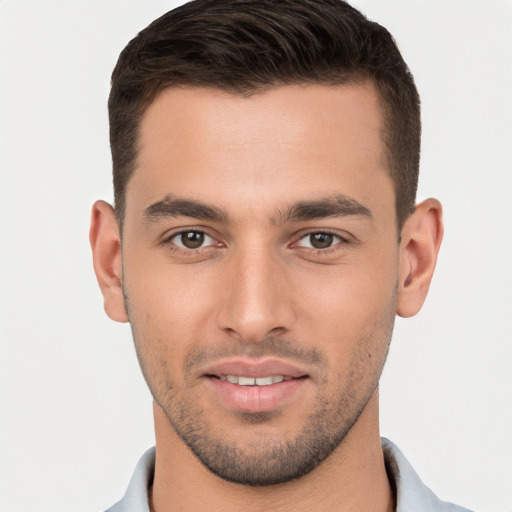 Joyful white young-adult male with short  brown hair and brown eyes